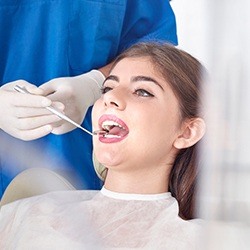 Femaile patient receiving dental exam