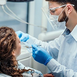 Closeup of dentist during dental bonding treatment