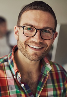 smiling man with glasses