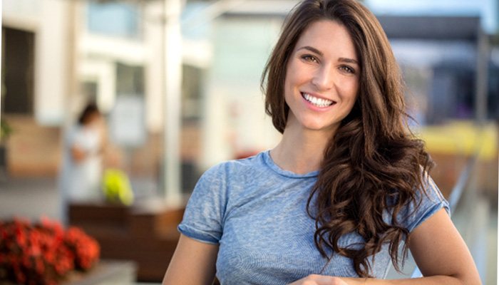 woman smiling outdoors  