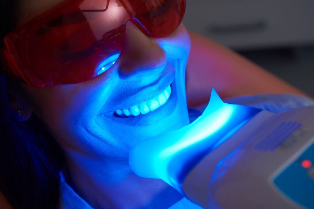 A woman getting professional teeth whitening