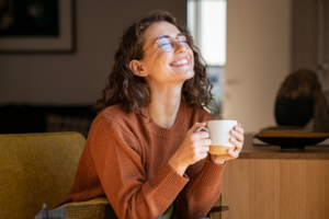 Woman enjoying a warm cup of coffee